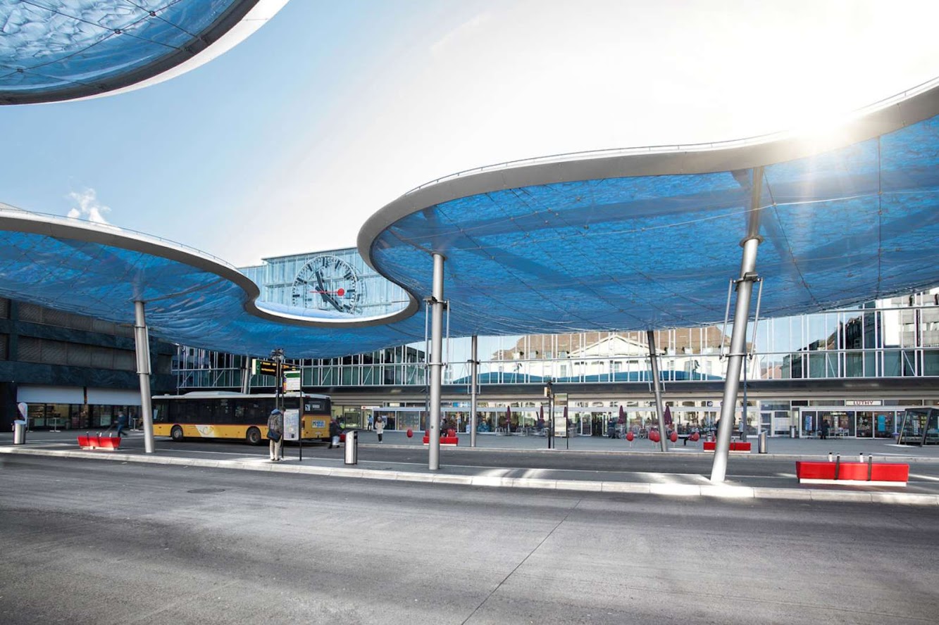 Bus terminal and train station square by Vehovar