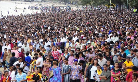 50,000 Adventist Church members and friends standing on the shore watching the baptism.