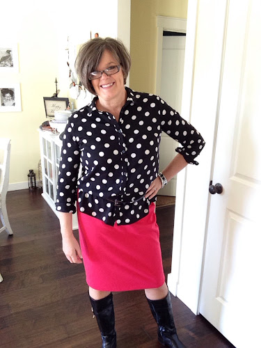 Black and white polka dotted blouse with red skirt