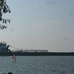 I talked a local into letting me borrow his windsurfer...and a huge barge passed by...miranda said it'll be our party barge next time