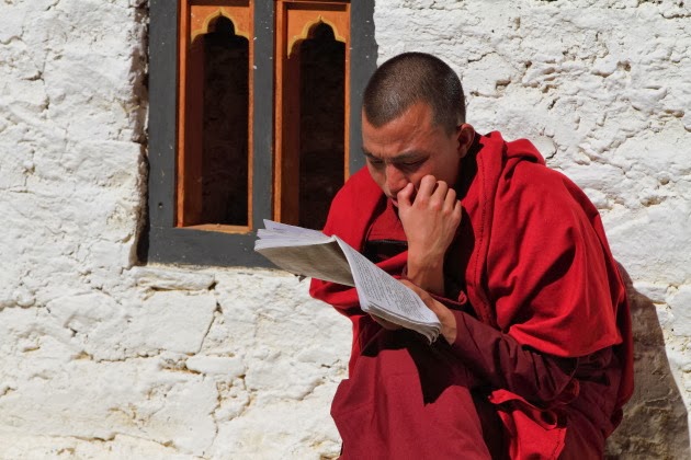 Buddhist Monk studies at Simtokha Dzong, Bhutan