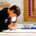 Art is integrated into the Montessori elementary curriculum. Here, a 1st year student is painting a map of North America. Look at the focus on his face. Imagine his pride when he can show his beautiful map to this parents!