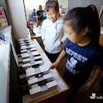 Things often considered "extra-curricular," such as art or music, are integrated into the Montessori elementary program. Here, students are playing music on the Montessori tone bars.