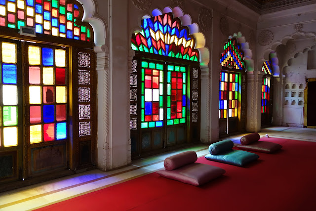 Colorful glass windows in a reception hall.