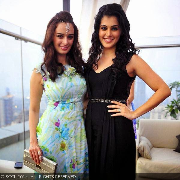 Evelyn Sharma and Taapsee Pannu pose together during a party organised by Jimmy Choo to celebrate 'Women's Day', organised at Hotel Palladium. Evelyn Sharma and Taapsee Pannu pose together during a party organised by Jimmy Choo to celebrate 'Women's Day', organised at Hotel Palladium.