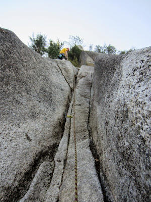 Looking up the top of pitch three (5.7)