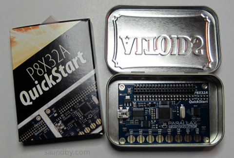 Parallax P8X32A Quickstart Board, shown inside an Altoids Tin for scale.