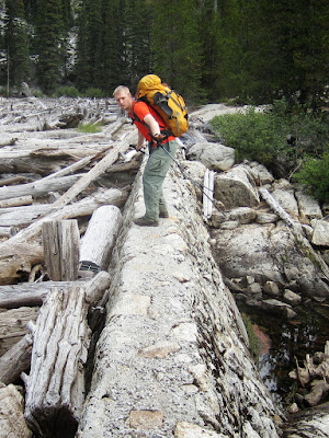 Aaron on the dam between upper and lower Snow Lake on the hike out