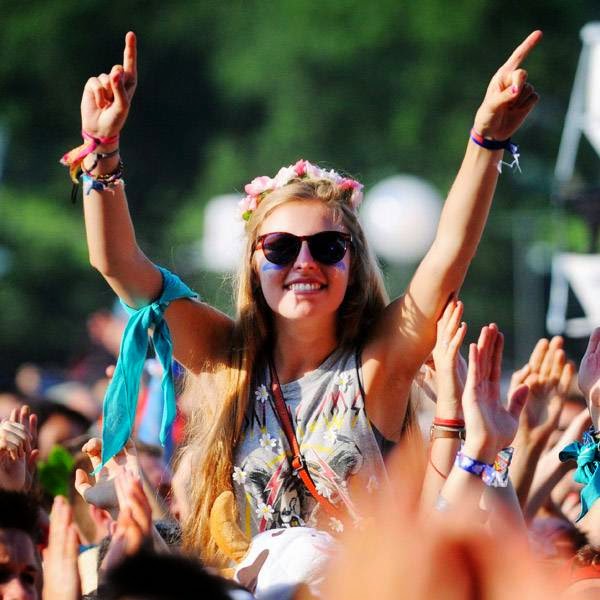 A spectator cheers during the concert of the French band 'Skip the Use' during the 23rd edition of the Festival des Vieilles Charrues in Carhaix-Plouguer, western of France on July 17, 2014.
