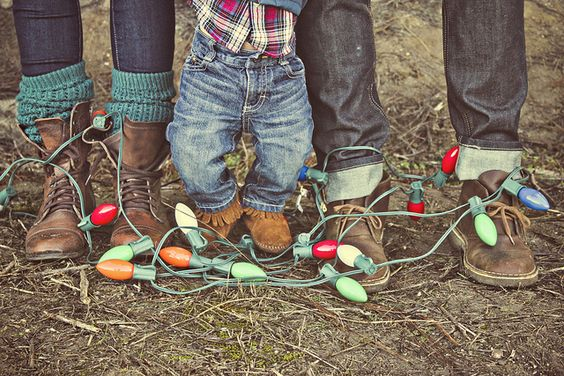 family with their shoes and christmas string lights