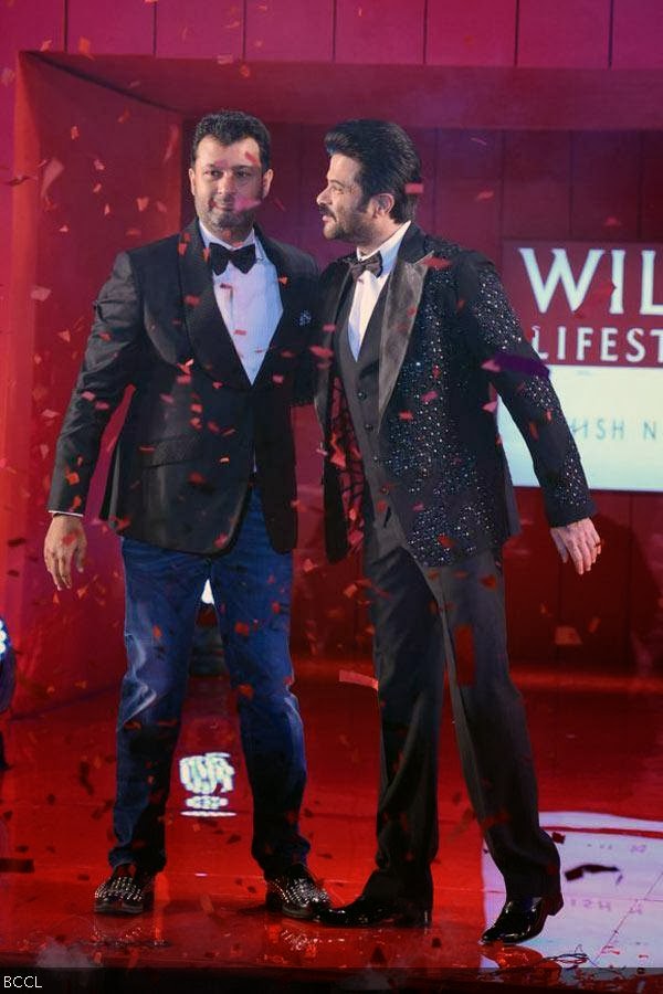 Anil Kapoor and designer Ashish N Soni walk the ramp during the grand finale of the Wills Lifestyle India Fashion Week (WIFW) Spring/Summer 2014, held in Delhi.(Pic: Viral Bhayani)