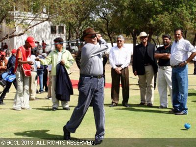 Col Bagga, swinging at the inauguration of the Kensville golf club, off Ahmedabad.