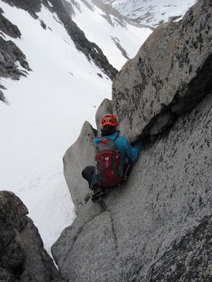 Sara trying to work her way down into the corner to reach the snow below
