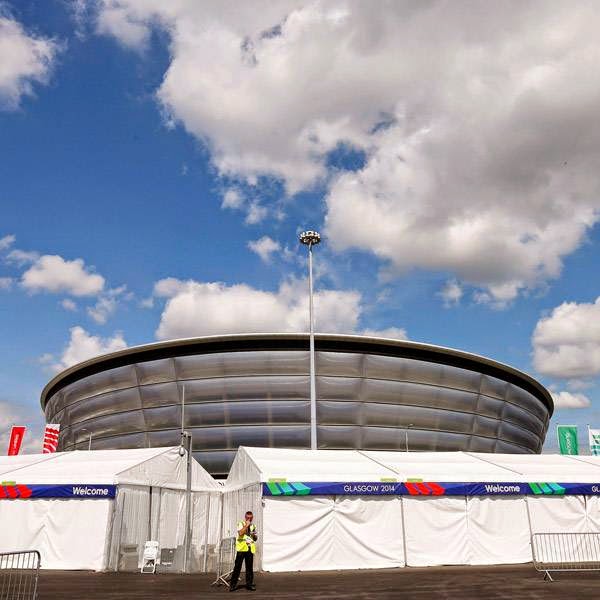 A guard stands outside the security perimeter of the SSE Hydro in Glasgow, Scotland, July 22, 2014. The SSE Hydro is part of the Scottish Exhibition and Conference Centre (SECC) Precinct, the host venue for six competitions - gymnastics, boxing, judo, netball, wrestling and weightlifting/powerlifting - of the Glasgow 2014 Commonwealth Games. 