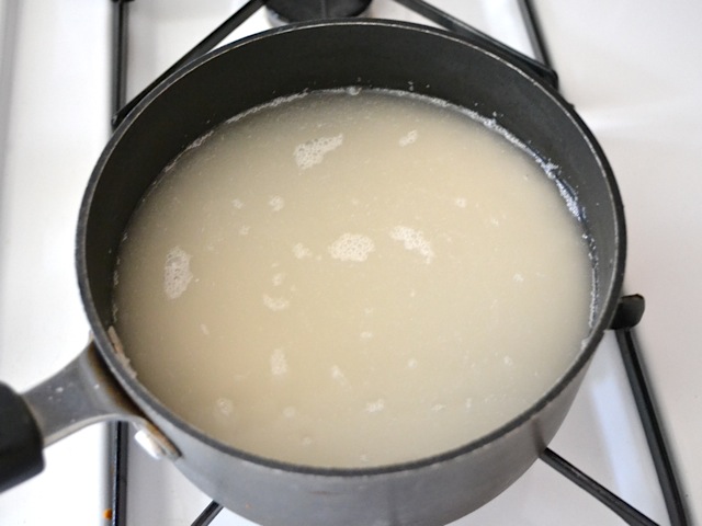 rice cooking in pot on stovetop 
