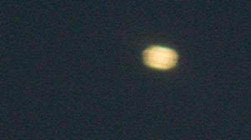 Fluorescent Oval Shaped Ufo Spotted Over Uk Photo