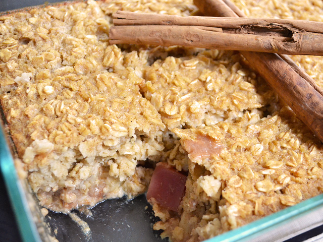Apple Pie Baked Oatmeal in baking dish with one slice taken out 
