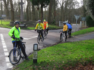 Cyclists emerging from park