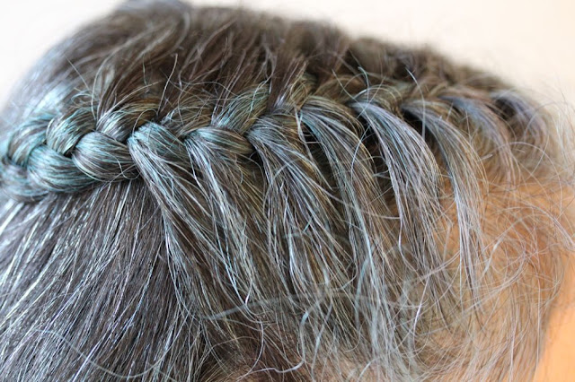 closeup of french-braided gray hair