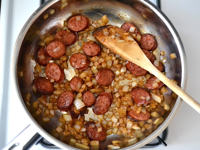 cooked onions and sausage in skillet 