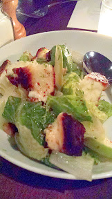 Cafe Castagna salad with baked halloumi cheese, romaine, apple, pomegranate, and candied nuts