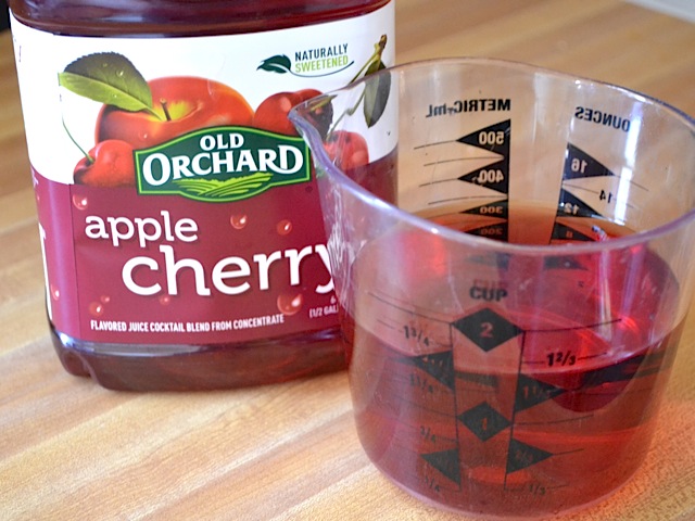 apple cherry juice in measuring cup 