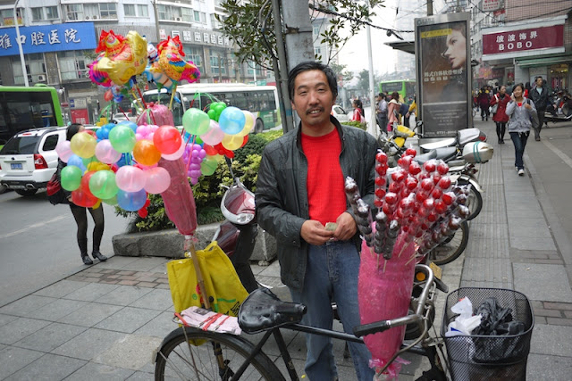 man selling balloons in Changsha, China