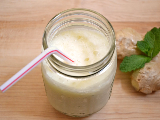 pineapple ginger lassi in mason jar with straw 