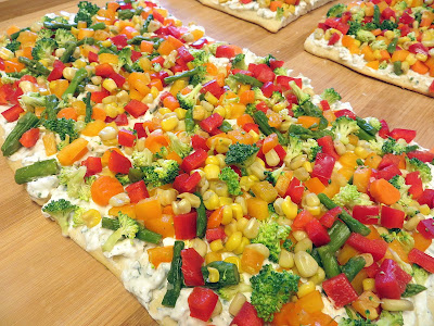 Summer Appetizer Recipe: Chilled Vegetable Pizza with dill/chive cream cheese mixture and broccoli, asparagus, baby carrots, red and orange bell peppers, corn kernels!