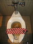 This is Tracy's Tie on a dirty toilet