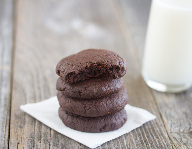 close-up photo of a stack of Midnight Cookies with a bite taken out of the top one