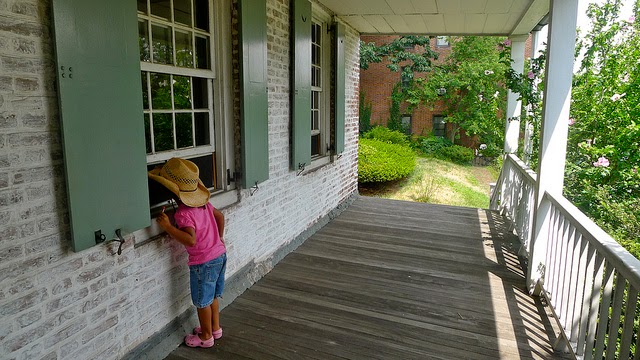 Our daughter, Mariel, looking into the Dyckman Farmhouse, the last colonial Dutch farmhouse in Manhattan.