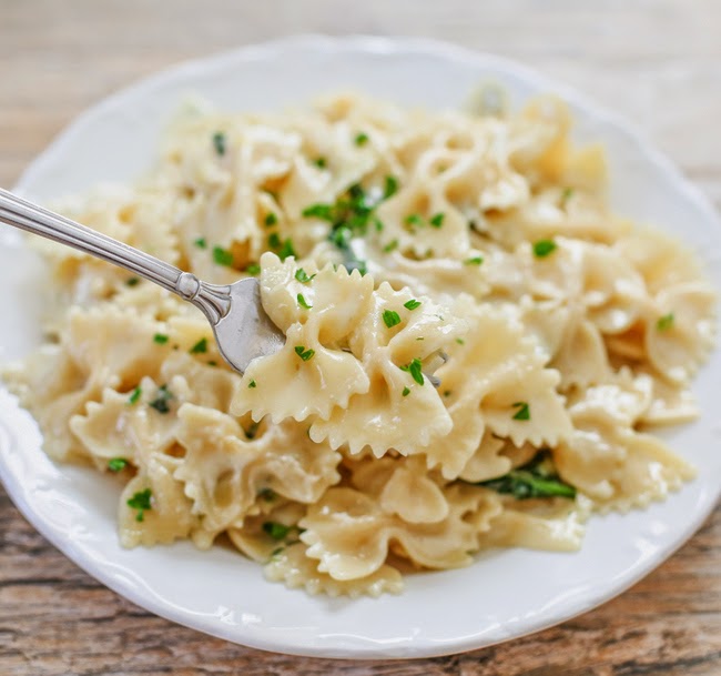 close-up photo of a forkful of alfredo pasta