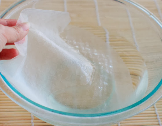 photo showing how to soak the rice wrappers in water