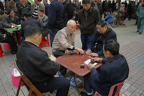 men playing a dominoes game in Changsha, China
