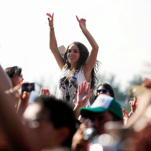 People attend British DJ Chris Lake's performance during the the first Day of the Corona Capital Music Fest at the Hermanos Rodriguez racetrack, in Mexico City, on October 12, 2013.