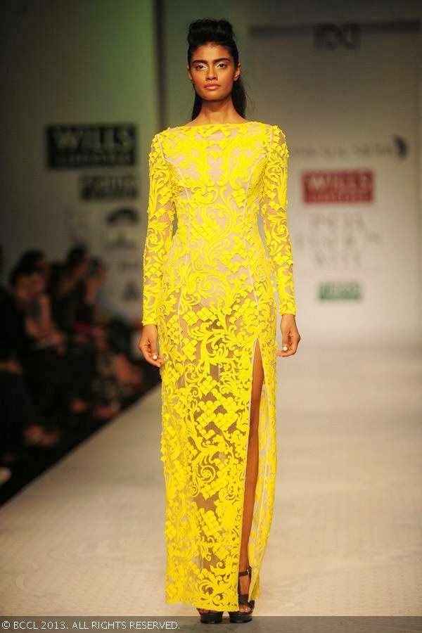 A model showcases a creation by designer duo Pankaj and Nidhi on Day 2 of the Wills Lifestyle India Fashion Week (WIFW) Spring/Summer 2014, held in Delhi.
