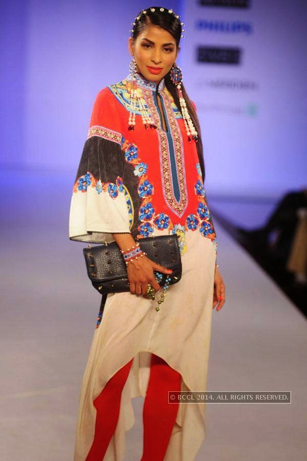 A model walks the ramp during Jabong Online Fashion Week, held at Hotel Le Meridian, in Delhi, on July 30, 2014. 
