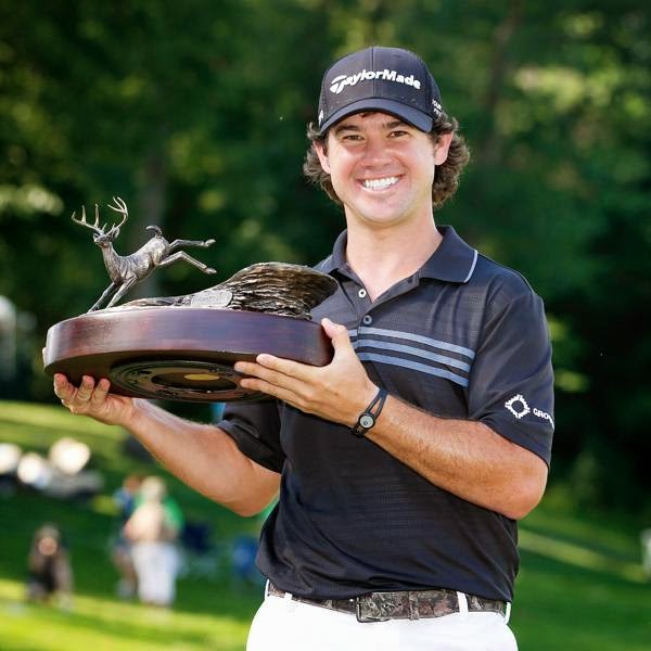 Brian Harman holds the trophy after winning the John Deere Classic held at TPC Deere Run, on July 13, 2014, in Silvis, Illinois.