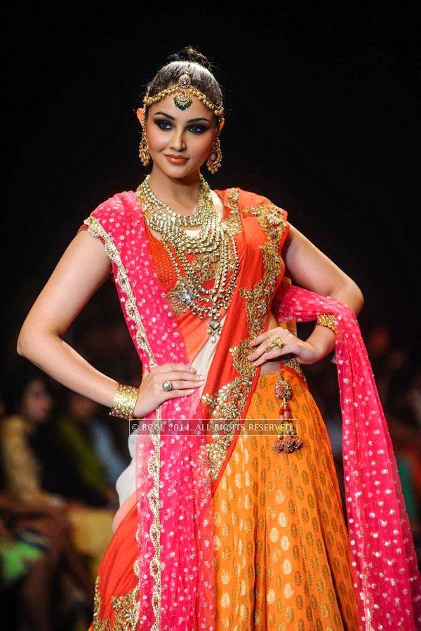 A model showcases a creation by Golecha Jewels on Day 3 of India International Jewellery Week (IIJW), 2014, held at Grand Hyatt, in Mumbai.<br /> <br /> <br /> 