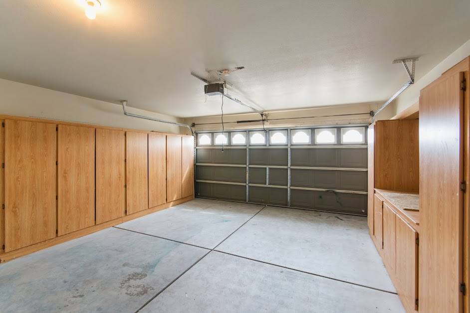 El Mirage Home for Sale showcases this garage with cabinets