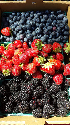 Marionberries, Strawberries, Blueberries in a flat at Portland Farmers at PSU