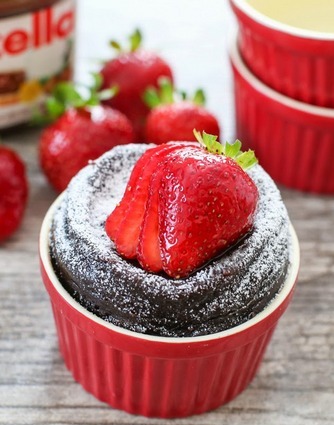 photo of nutella mug cake garnished with fresh strawberries