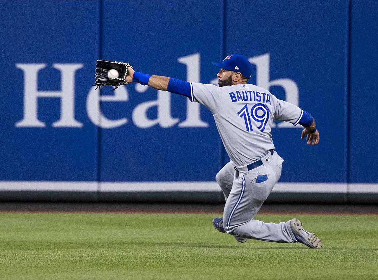 Jose Bautista catching a baseball