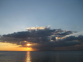 looming storm clouds and a golden sunset