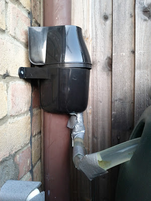 Drainpipe diverter and gaffer-taped tube to water butt