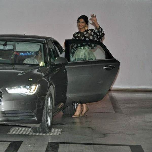 Sonam Kapoor waves for the lens as she leaves after attending Karan Johar's party, organised at his residence, on July 26, 2014.(Pic: Viral Bhayani)