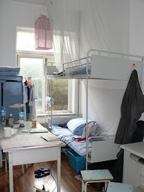 bunk bed and table in a dorm at Dalian Maritime University in China
