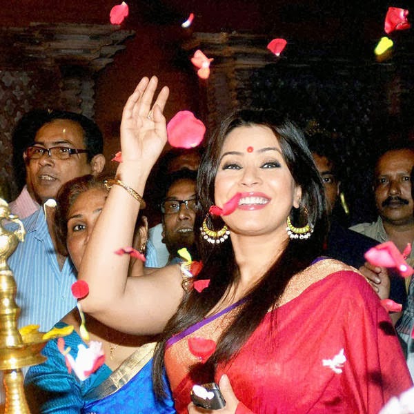 Bollywood actress Mahima Chaudhry waves to her fans during the inauguration of a Durga Puja pandal in North 24 Pargana district in West Bengal.