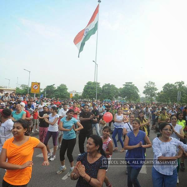 People dance during the Raahgiri Day, held at Connaught Place.